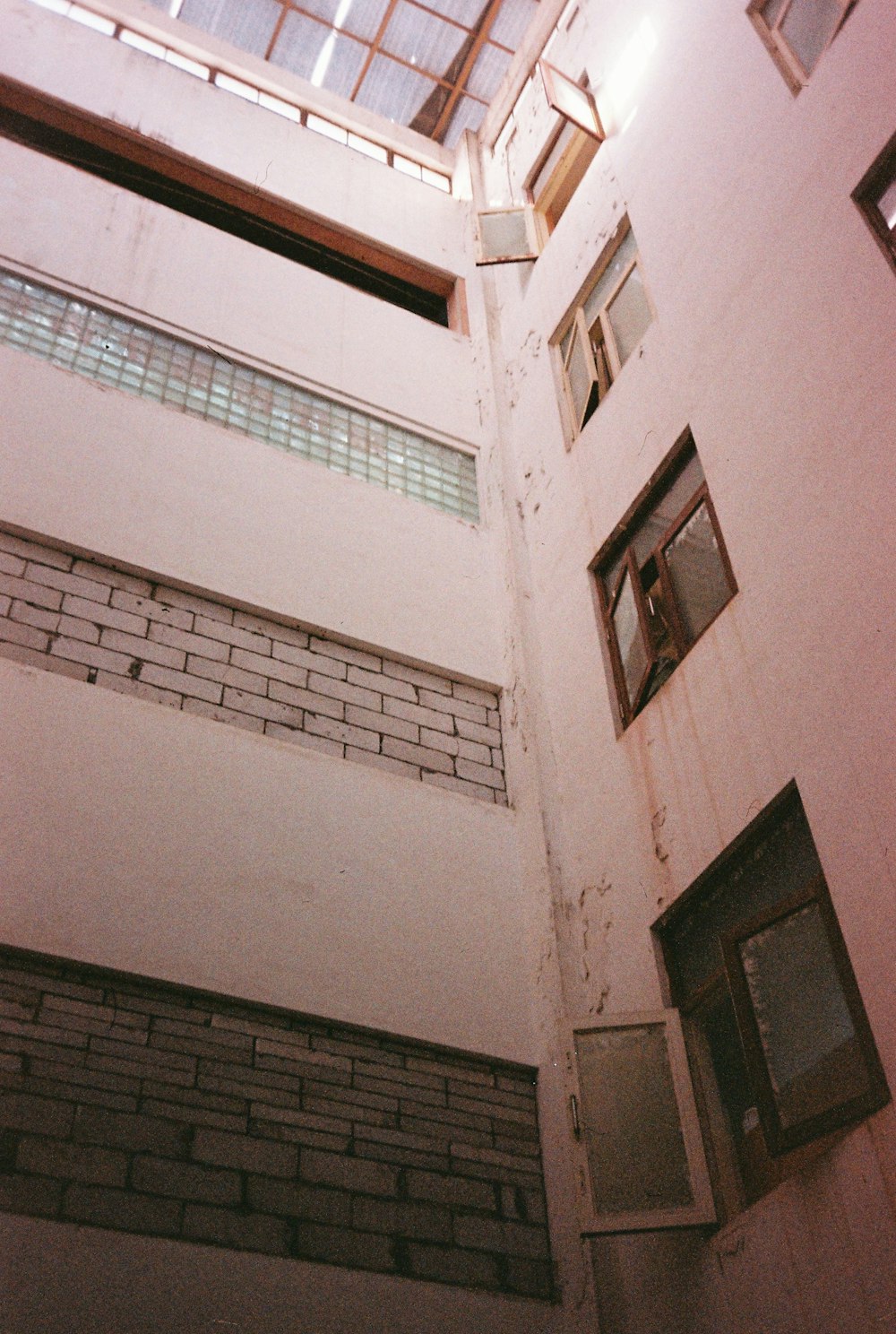 a tall building with windows and a skylight