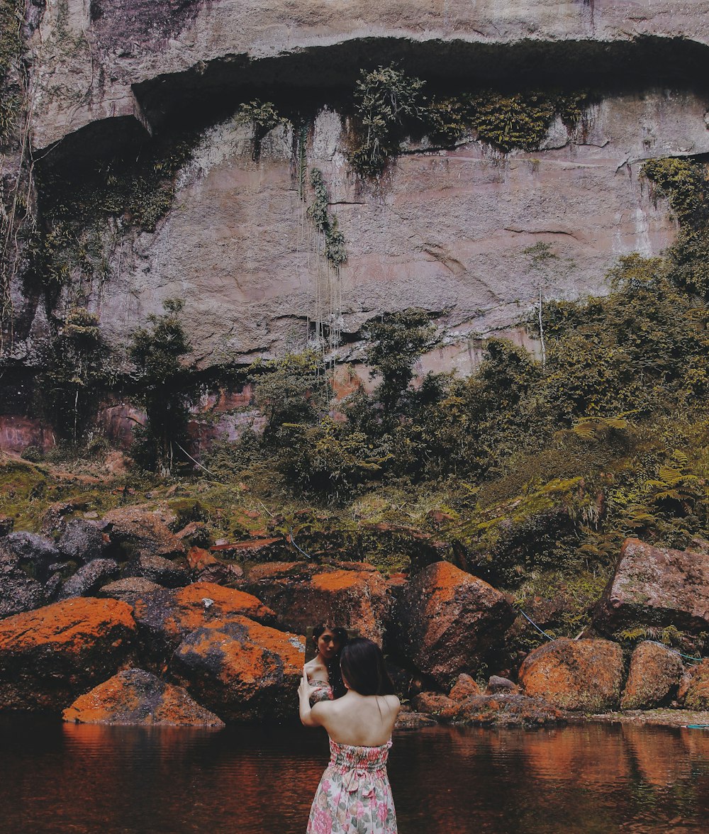 a woman standing in a body of water