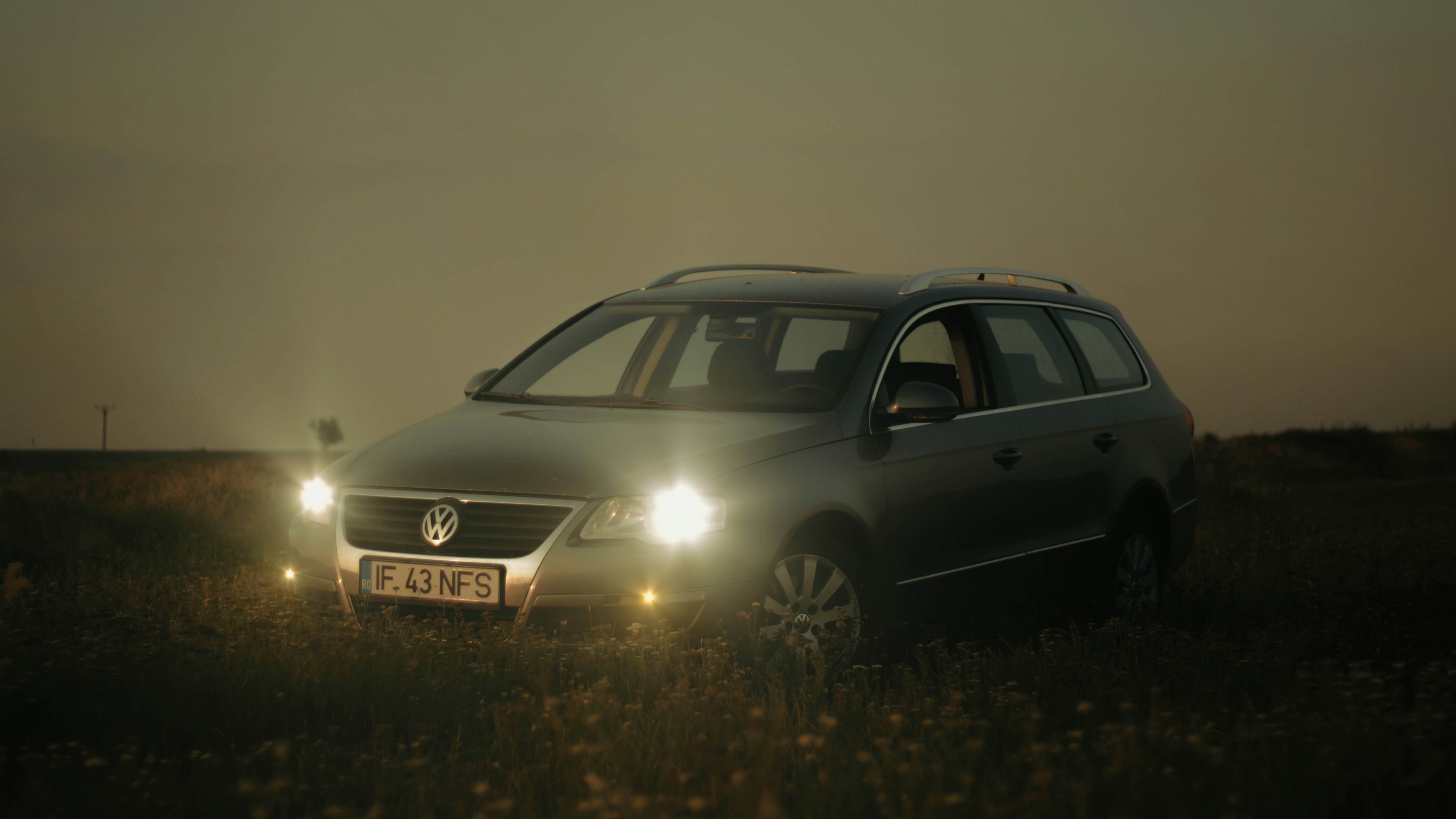 a car parked in a field at night