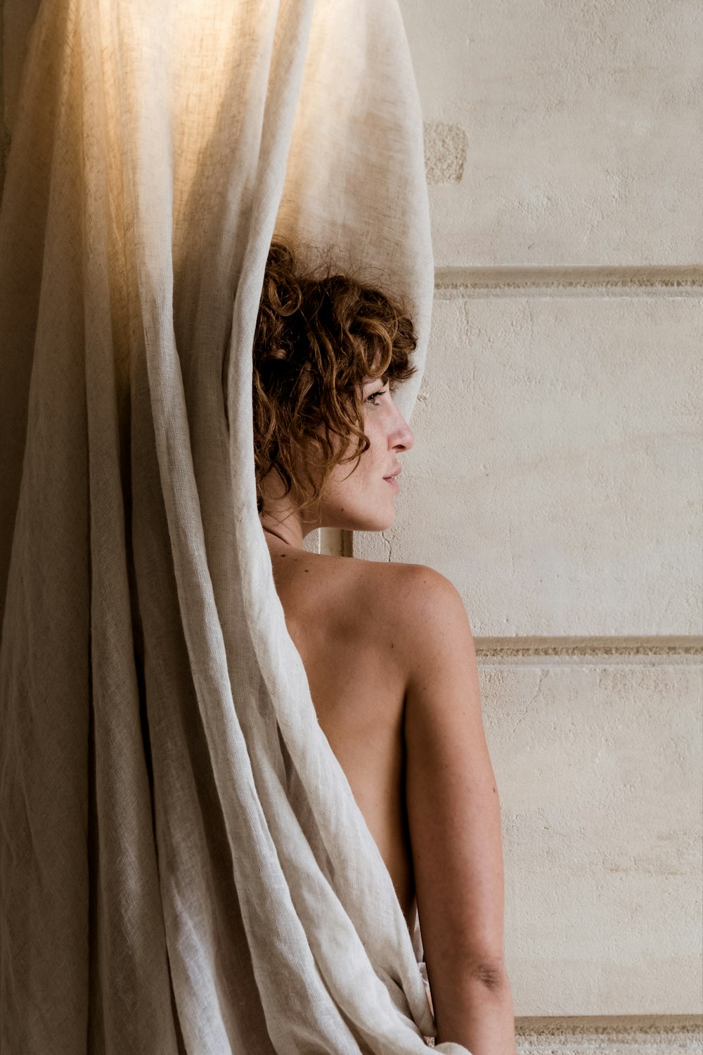 a woman is wrapped up in a towel