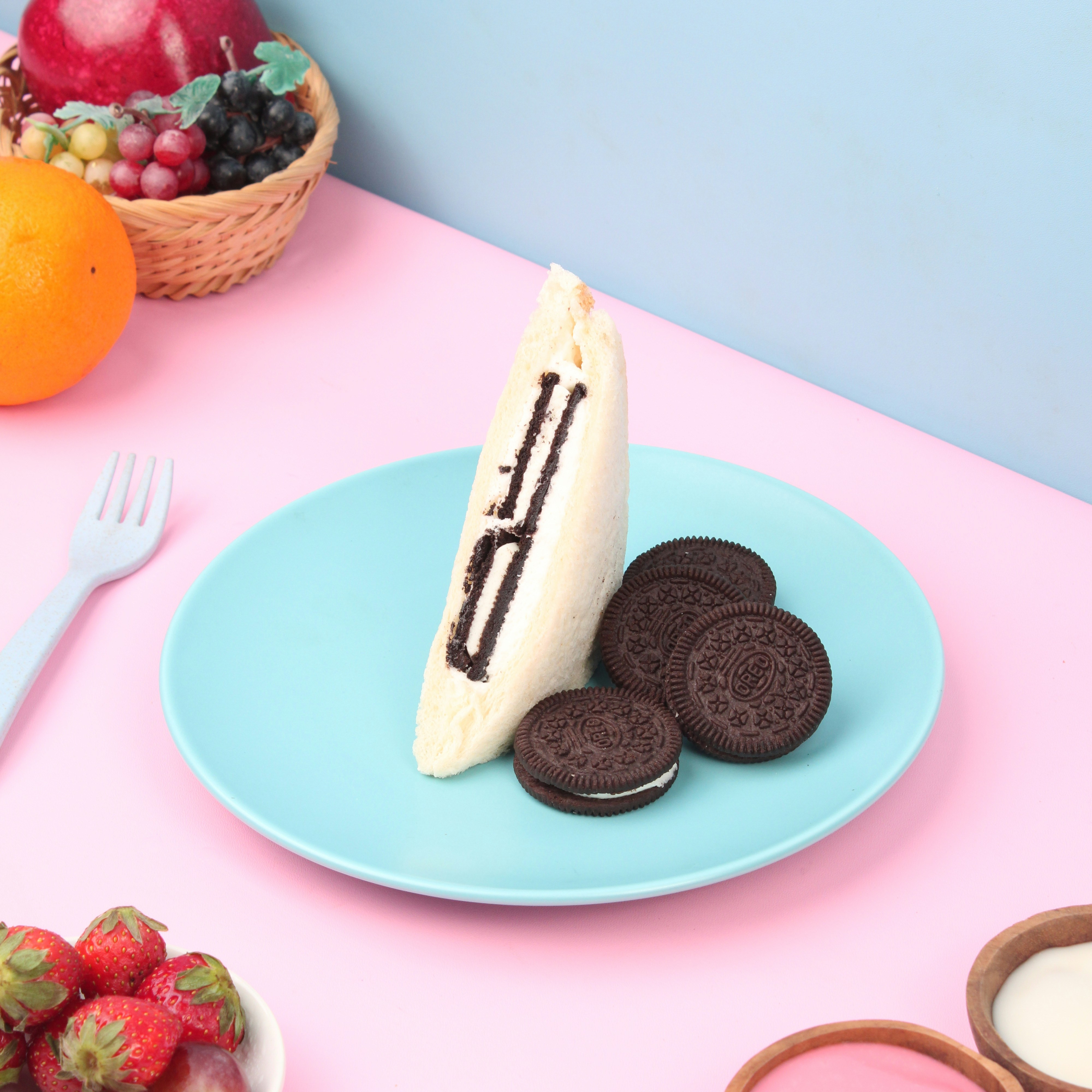 a blue plate topped with a piece of cake and cookies