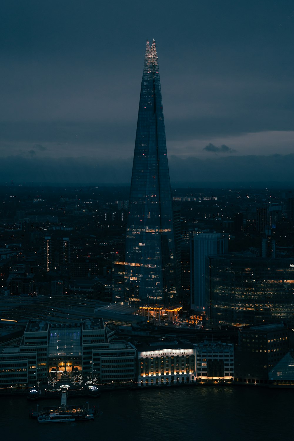 the shard of the building is lit up at night