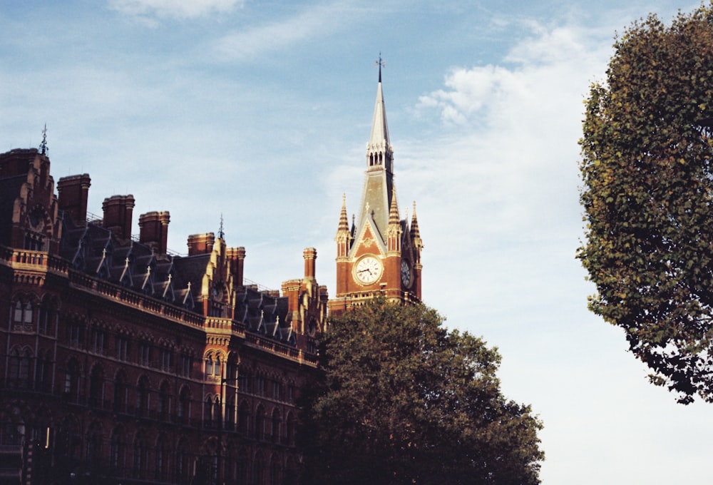 a tall building with a clock on the top of it