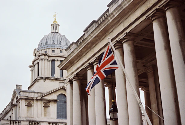 a british flag flying in front of a building