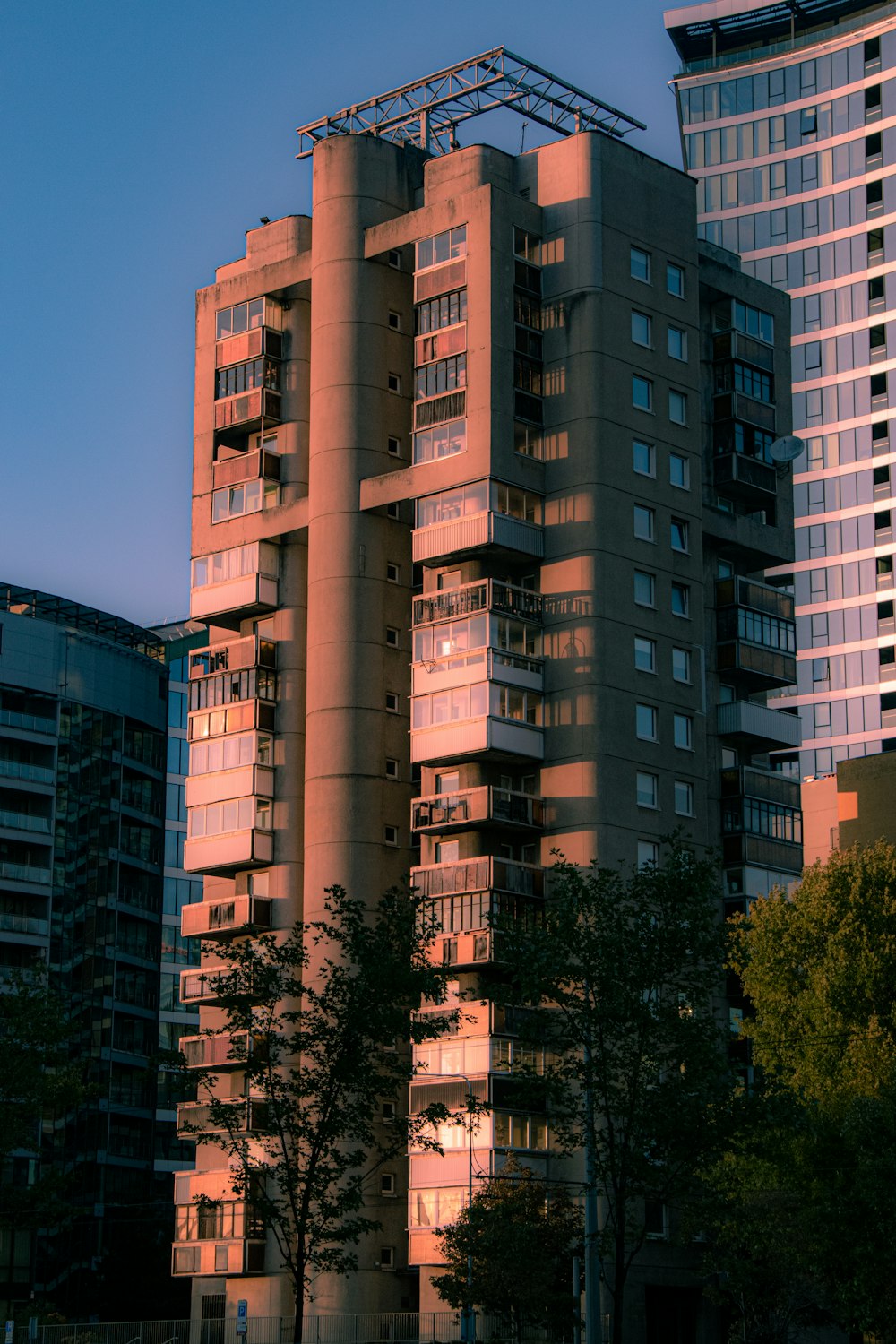 a tall building with lots of windows and balconies