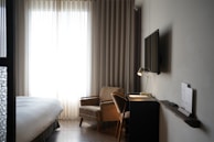 A cozy guest room with modern furnishings.