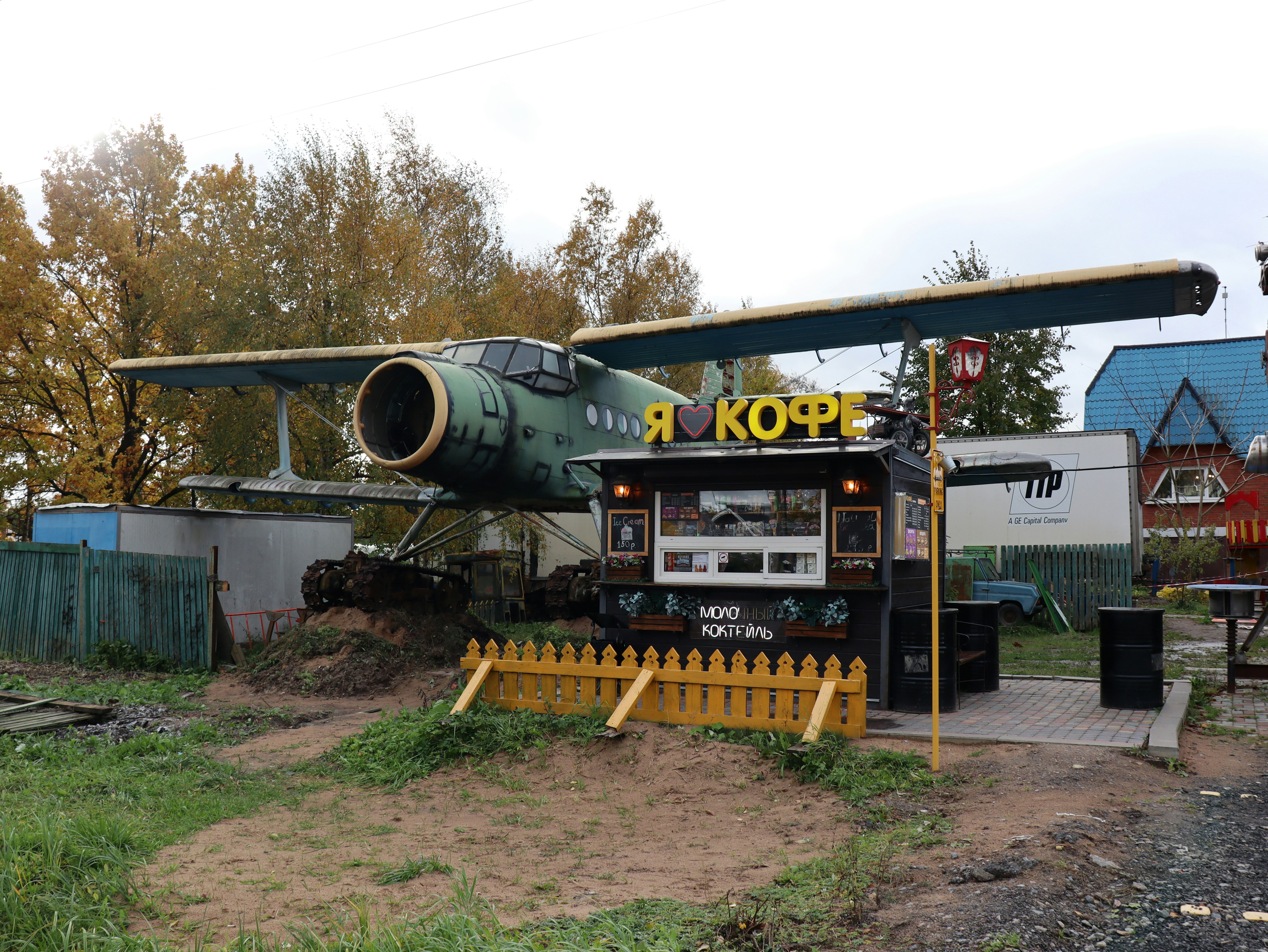 A green airplane sitting on top of a field photo – Free Car Image on ...