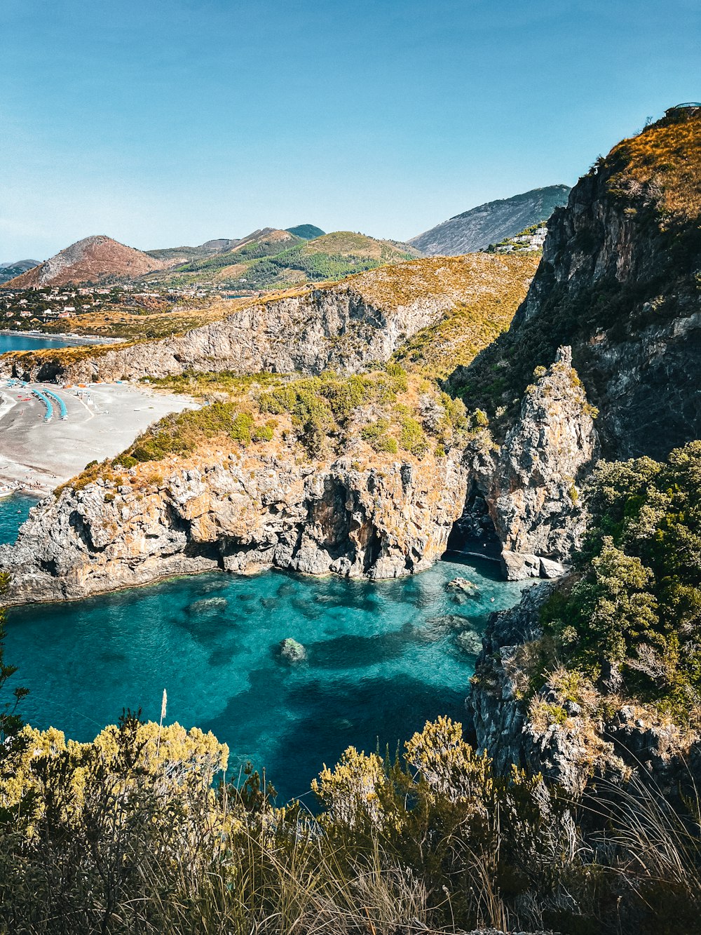 a body of water surrounded by mountains and trees