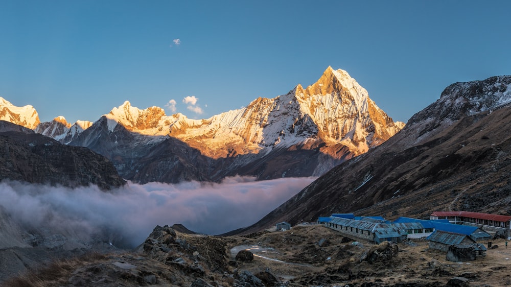 a view of a mountain range covered in clouds