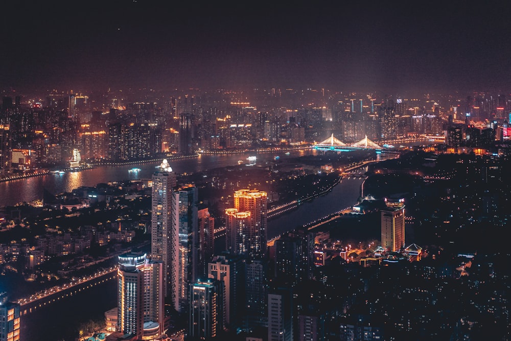 a view of a city at night from the top of a building