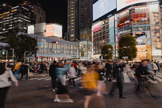 A vibrant city street showing people moving quickly with ease, symbolizing urban agility.