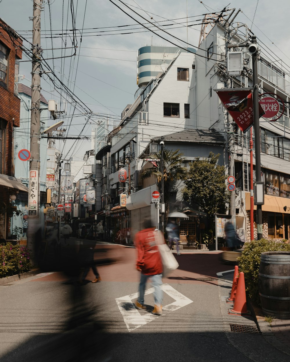 a blurry photo of a person crossing a street