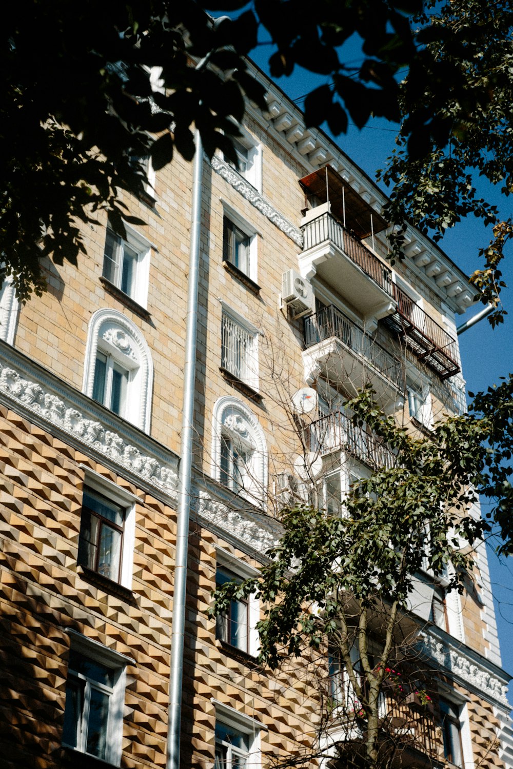 a tall brick building with balconies and balconies