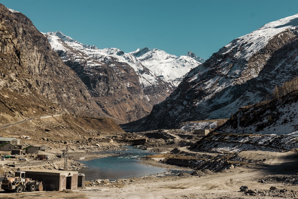 a mountain range with a body of water in the foreground