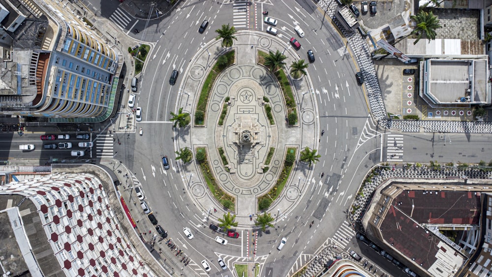an aerial view of a city intersection with a clock tower