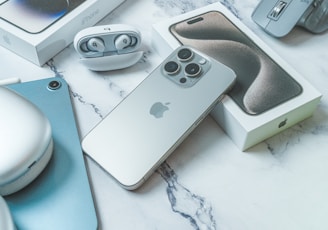 a couple of cell phones sitting on top of a table