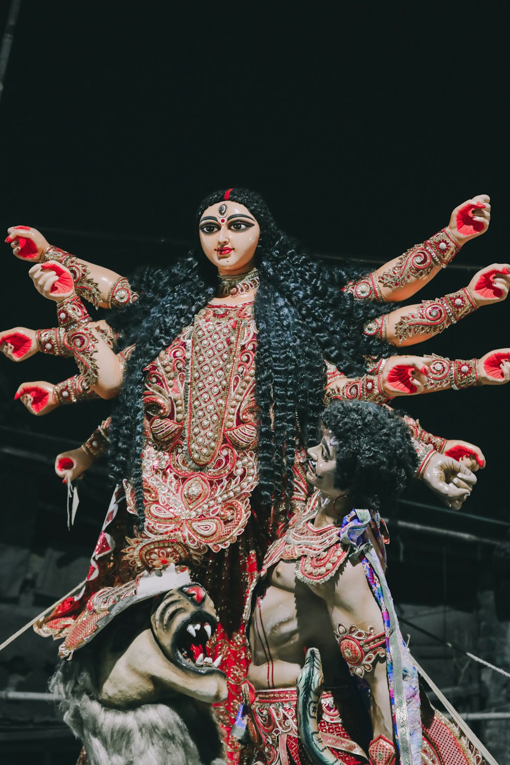 a statue of a woman with her arms outstretched