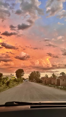 A rural hospital’s emergency department exterior under a vibrant sunset