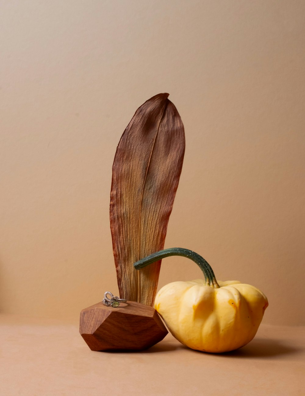 a couple of pumpkins sitting on top of a table