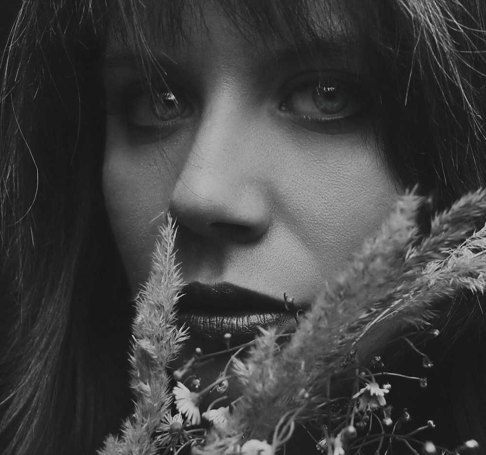 a black and white photo of a woman with long hair