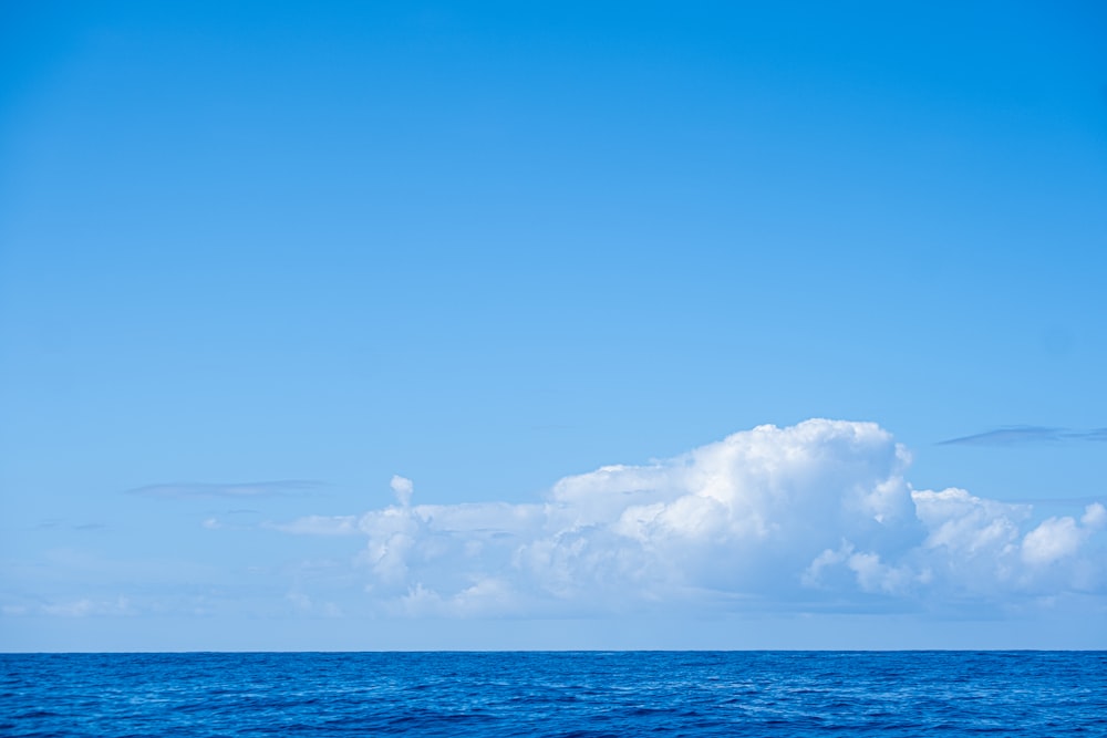 a boat floating on top of a large body of water