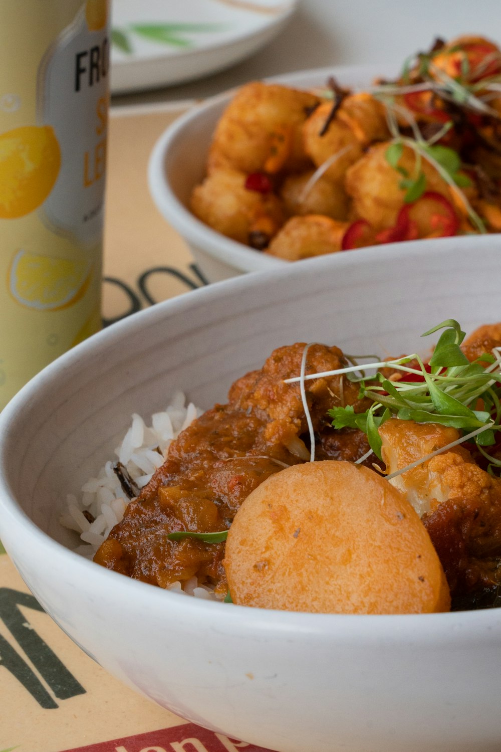 a close up of a bowl of food on a table