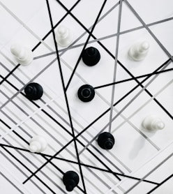 a group of black and white knobs on a wall