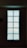 A rectangular arrangement of glass blocks with intricate patterns that allow light to pass through, creating a glowing effect against a dimly lit background.