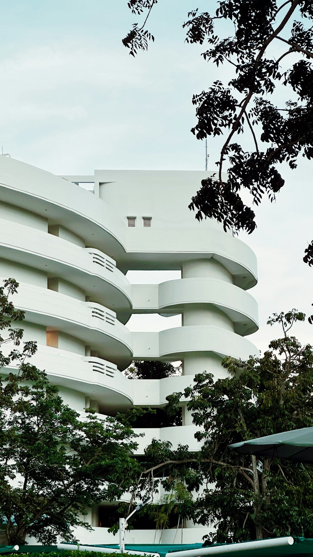 a large white building with many balconies on top of it