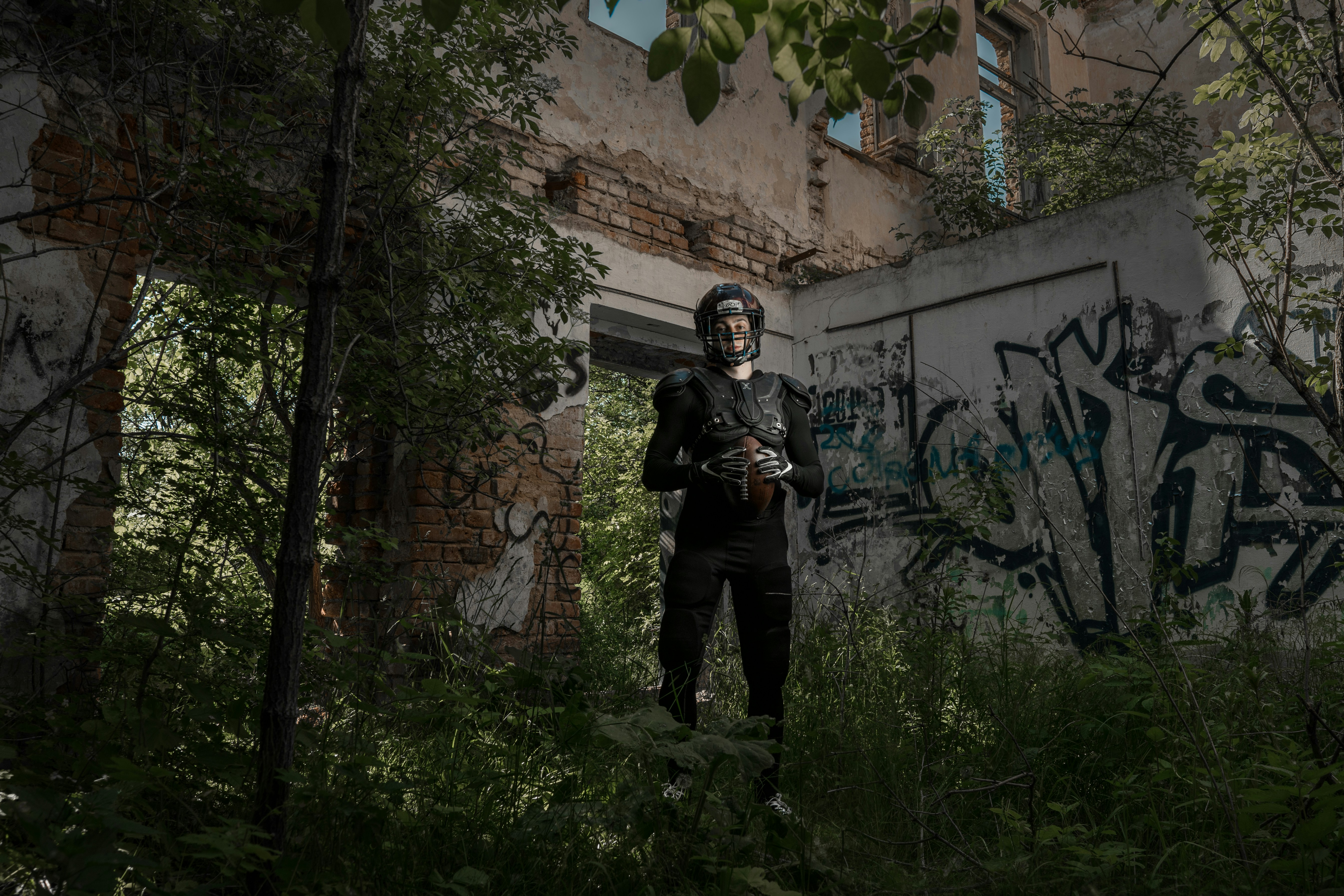 a man in a mask standing in a forest
