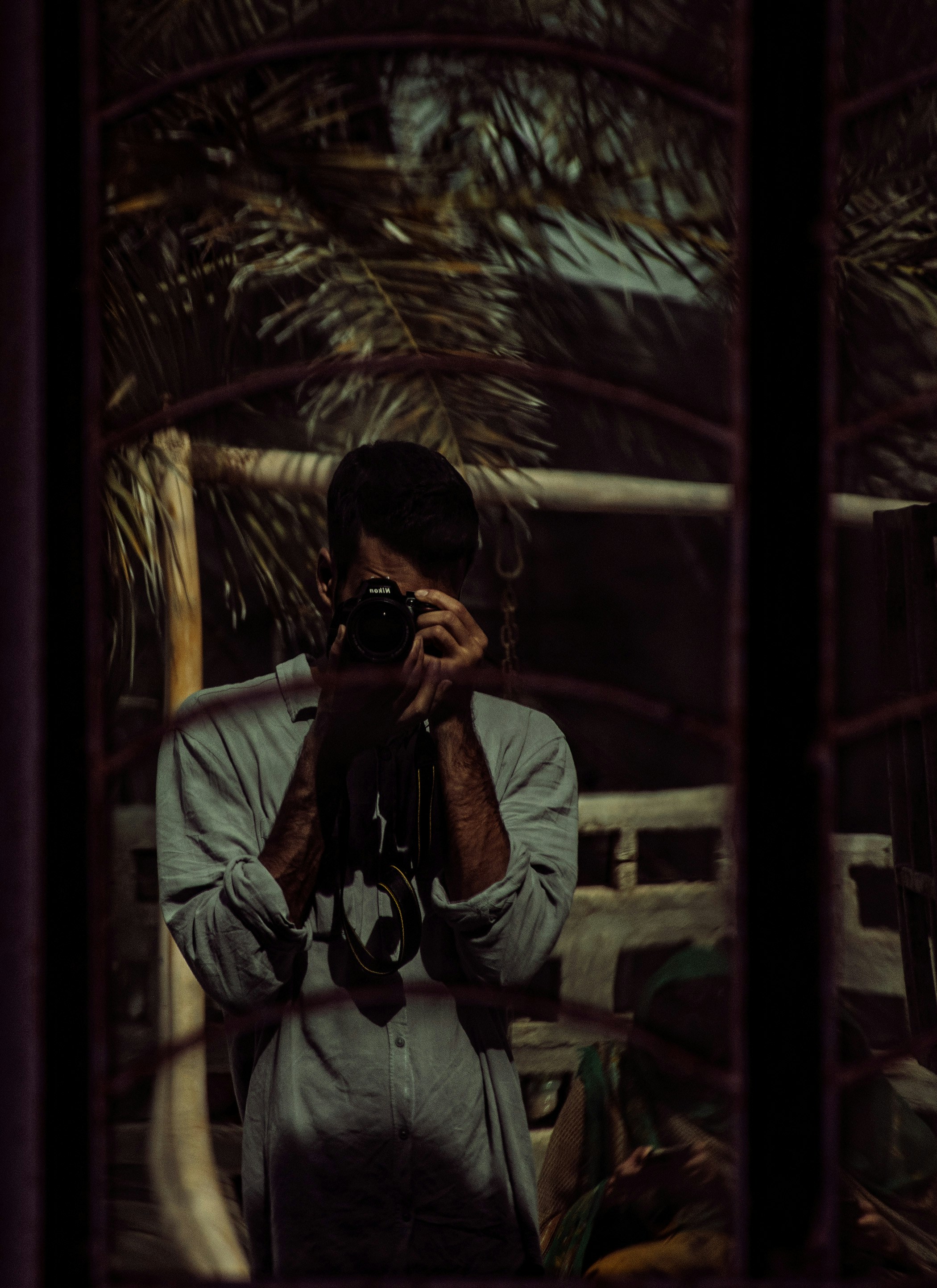 a man taking a picture of himself in a mirror