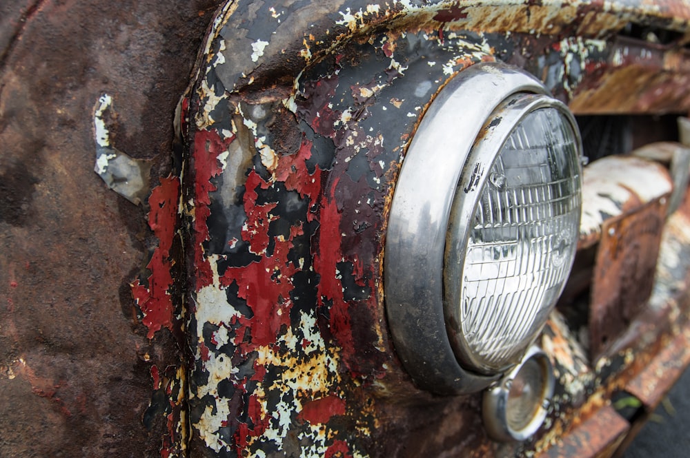 a close up of an old rusted car