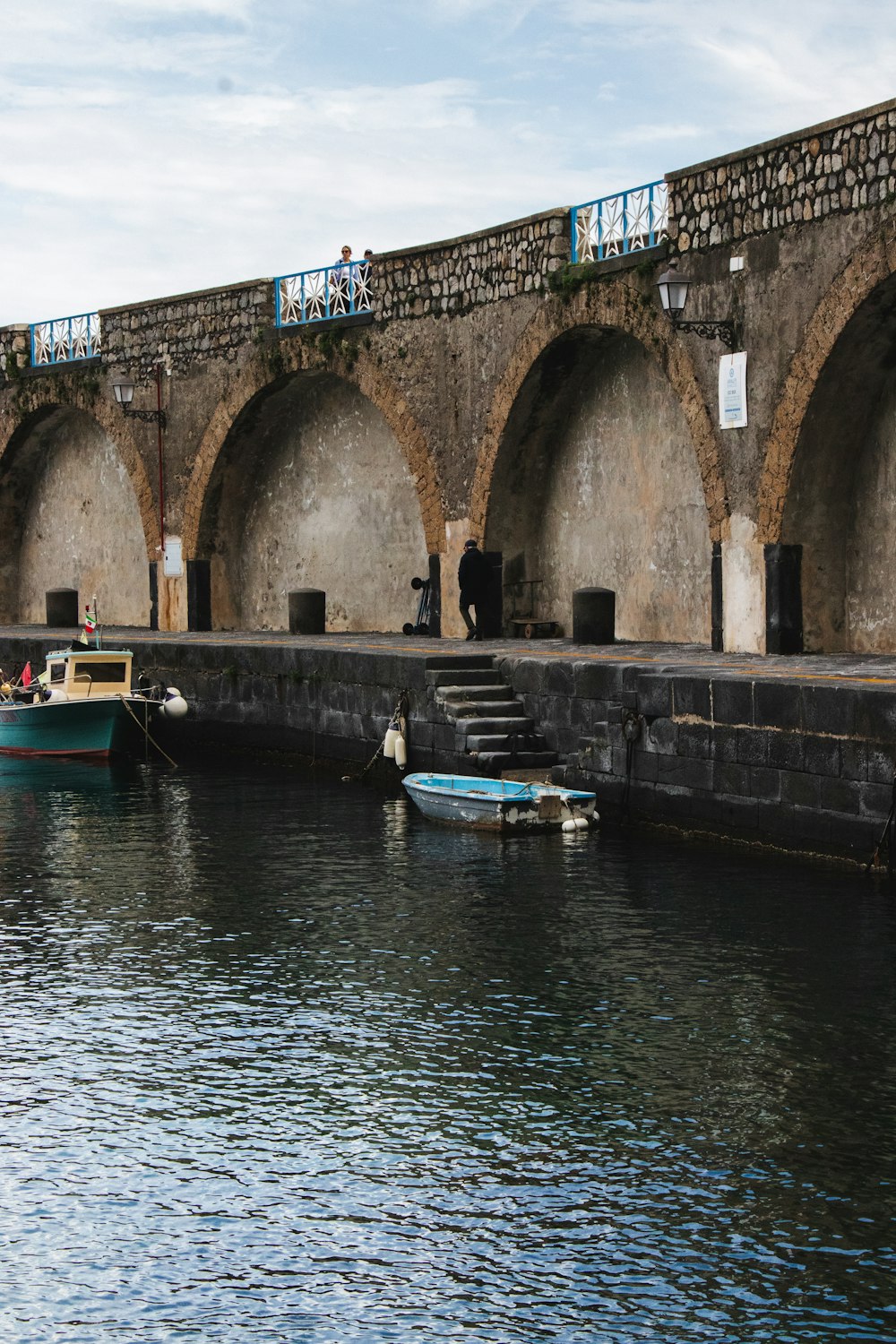 a couple of boats that are sitting in the water