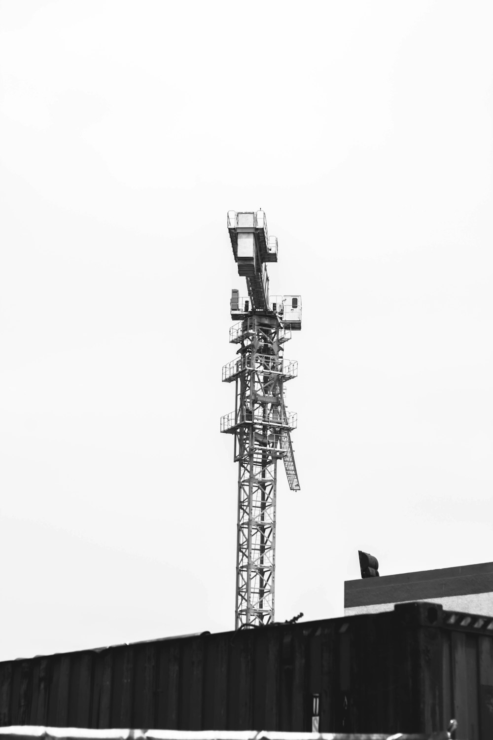 a black and white photo of a cell phone tower