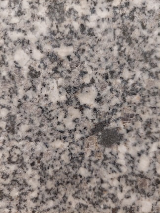 Close-up of polished granite slabs showcasing natural patterns and colors.