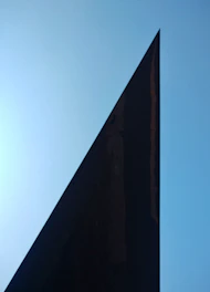 Bold, sharp lines cutting through a dark blue background symbolizing clarity and truth.