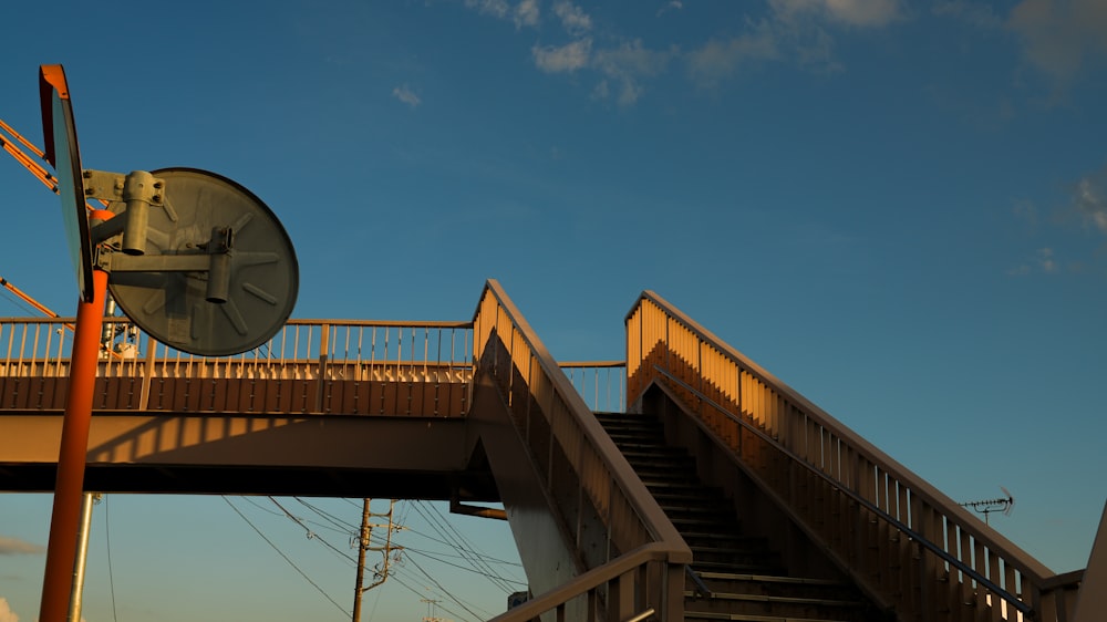 a clock sitting on top of a metal pole