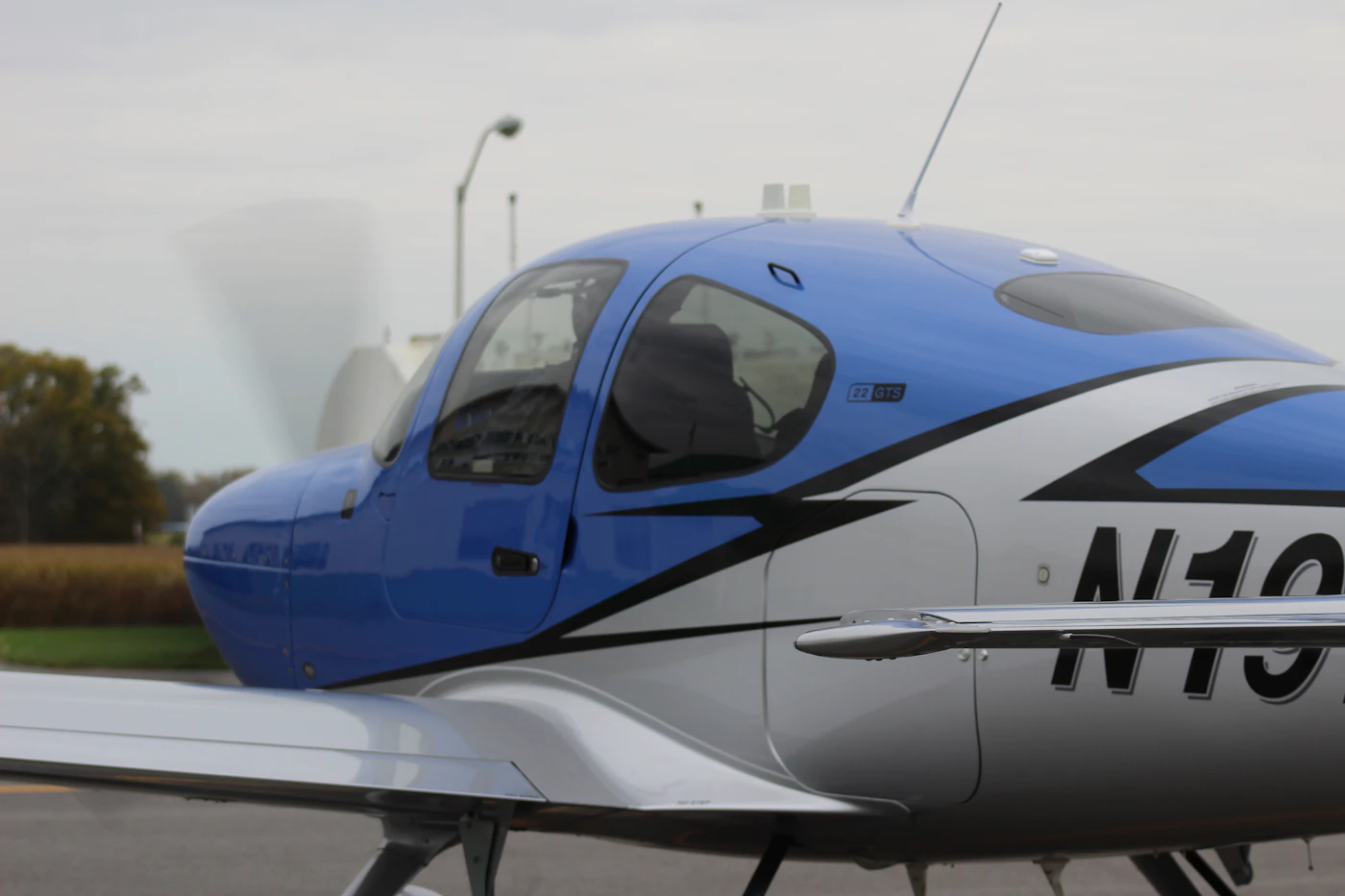 Cirrus aircraft on the ramp with the propeller turning