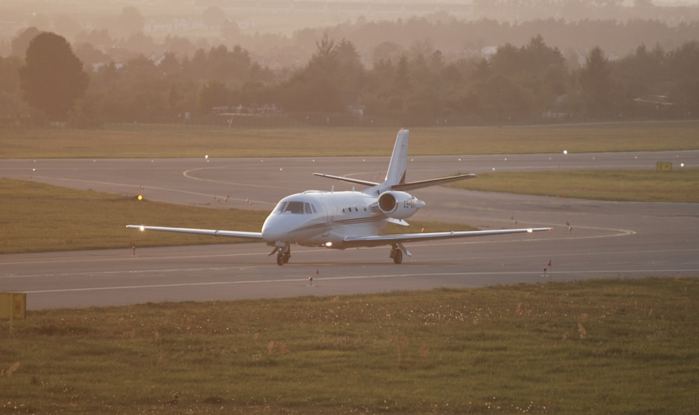 a plane is on the runway of an airport