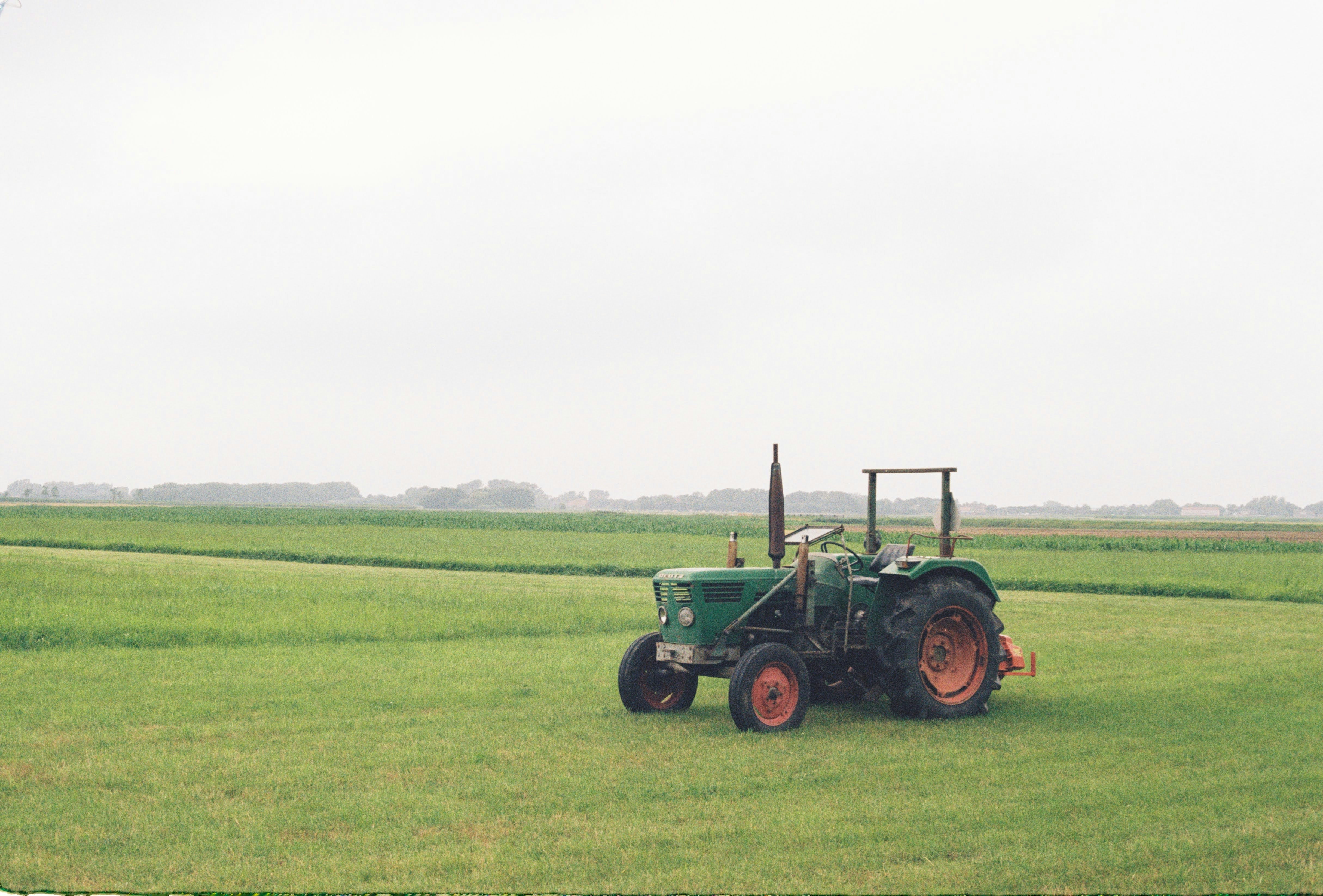 a tractor in a field of green grass