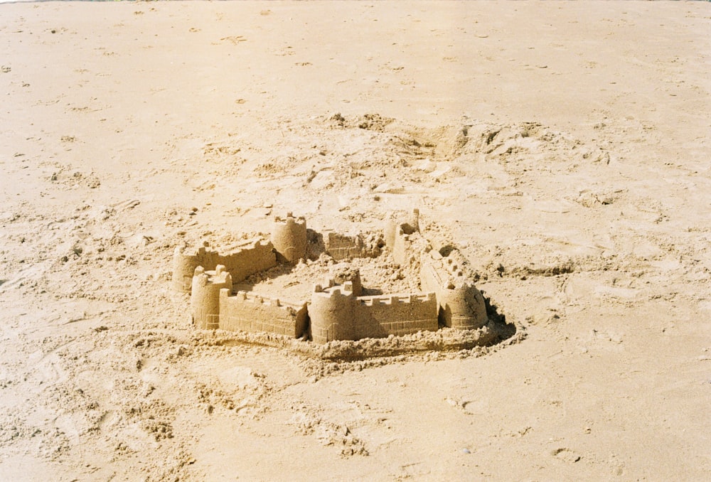 a sand castle made of sand on a beach