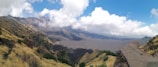 A panoramic view of the lush green slopes and volcanic landscape of Mount Rinjani.