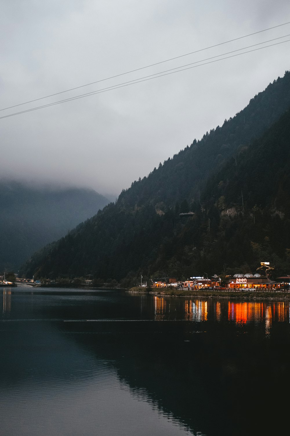 a body of water with a mountain in the background