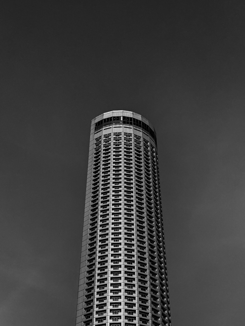 a black and white photo of a tall building