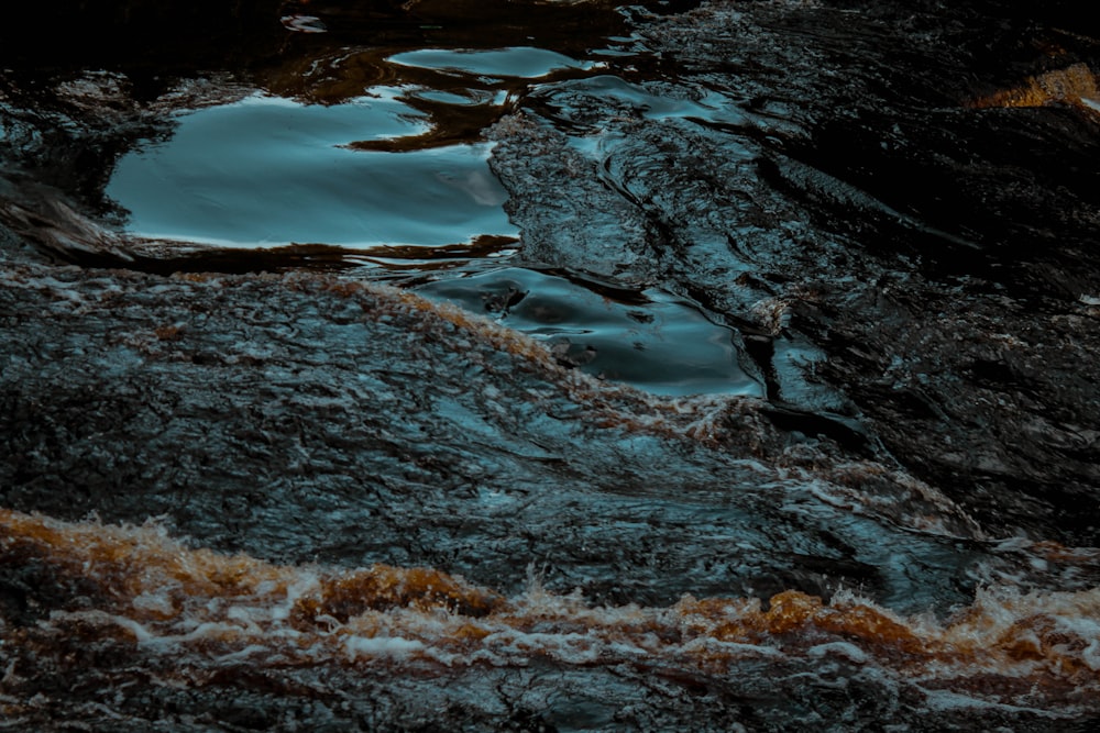 the water is flowing over the rocks in the river