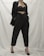 A stylish woman wearing a chic outfit from emma hughes.