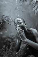 Close-up of a child laughing while experiencing rain effects in the 7D cinema.