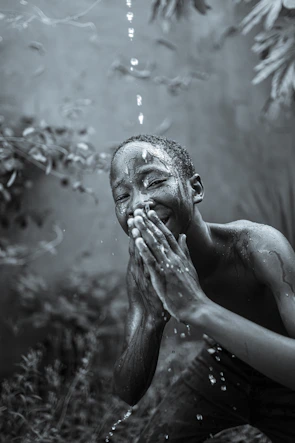 Close-up of a child laughing while experiencing rain effects in the 7D cinema.