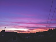 A sunset view over a Jamaican neighborhood where voices for change rise.