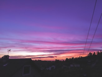 A sunset view over a Jamaican neighborhood where voices for change rise.